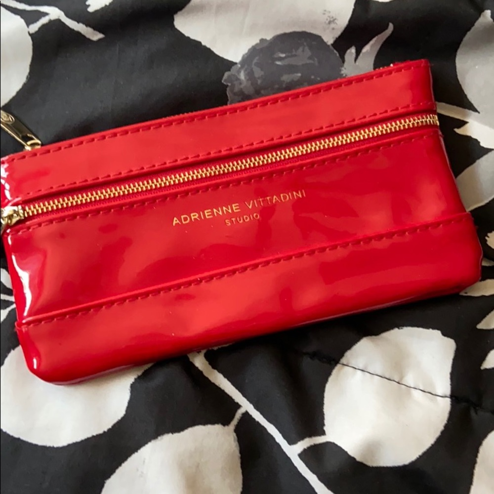 Adrienne Vittadini red plastic vinyl wallet .